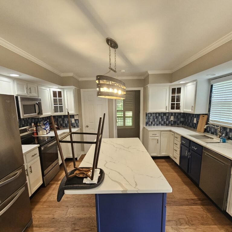 Kitchen with white cabinets and a dining area