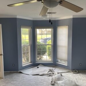 Freshly painted blue room with a bay window