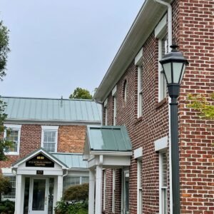 Brick building exterior with white trim